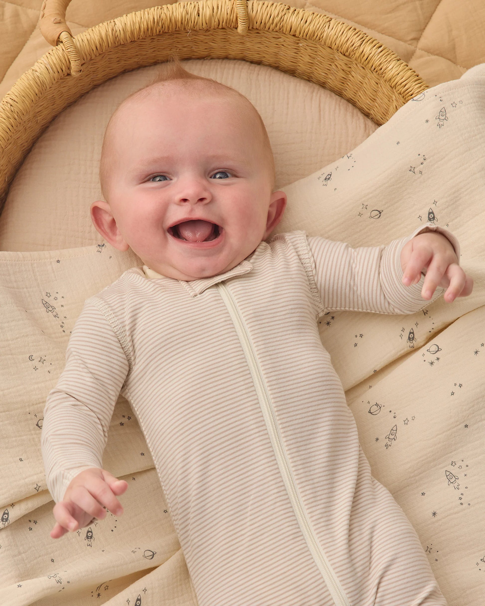 Quincy Mae oatmeal micro stripe zip-up long sleeve sleeper footie for babies, soft and cozy with front zipper and footed design.