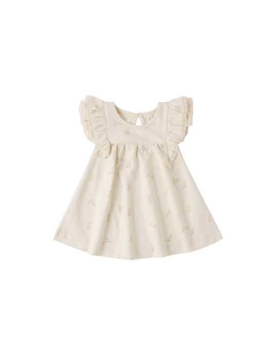 Quincy Mae Bunnies Flutter Dress in natural fabric with flutter sleeves, perfect for babies or toddlers.