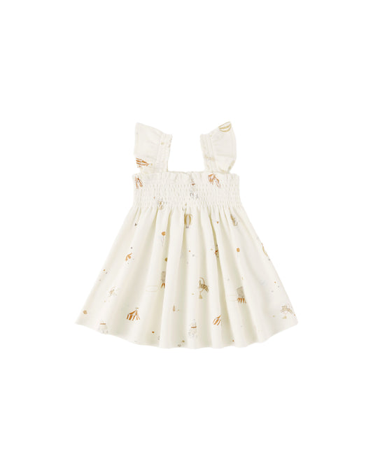 Quincy Mae Carnival Smocked Jersey Dress in ivory, featuring a smocked bodice and lightweight fabric for a comfortable, stylish look.