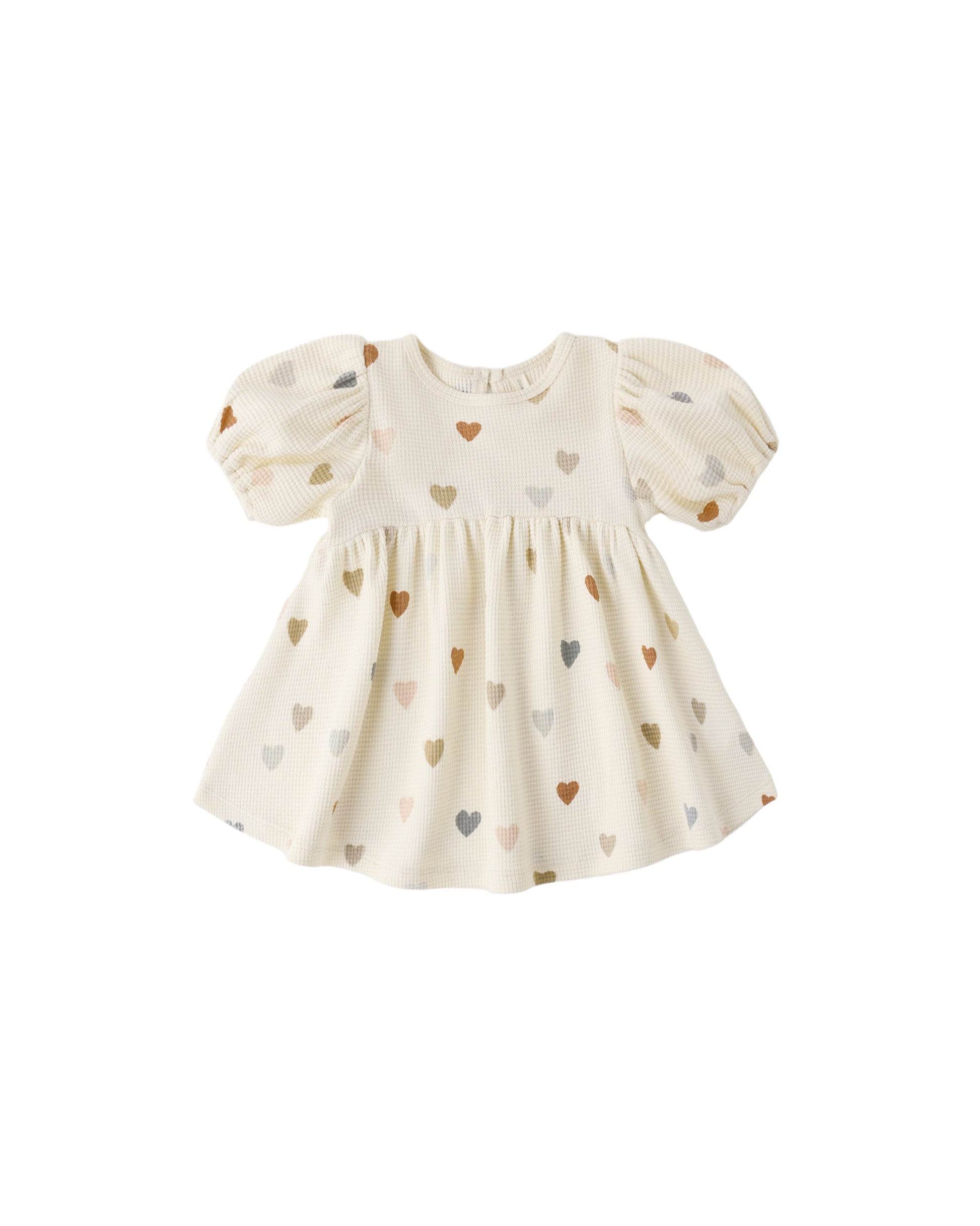 Confetti Hearts Darla Dress by Quincy Mae, natural-colored dress with colorful heart patterns, displayed hanging on a white background.