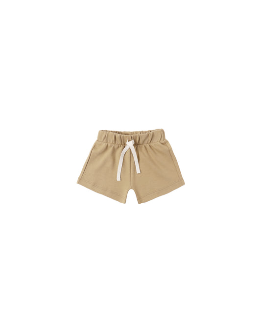 Honey Play Short by Quincy Mae, soft beige toddler shorts with an elastic waistband, displayed on a white background.