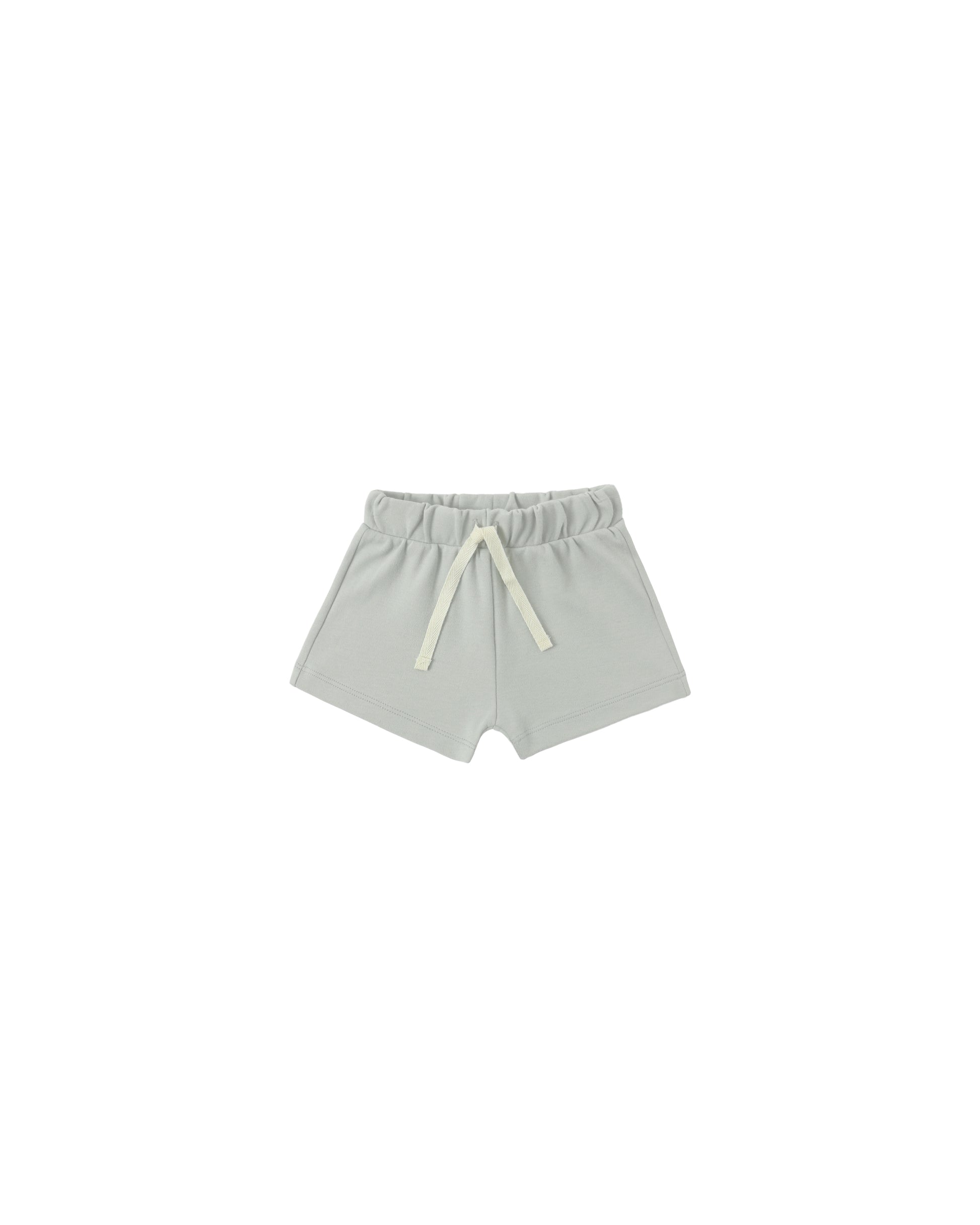 Quincy Mae Sage Play Short in soft sage green fabric, featuring a comfortable elastic waistband and casual style for kids.