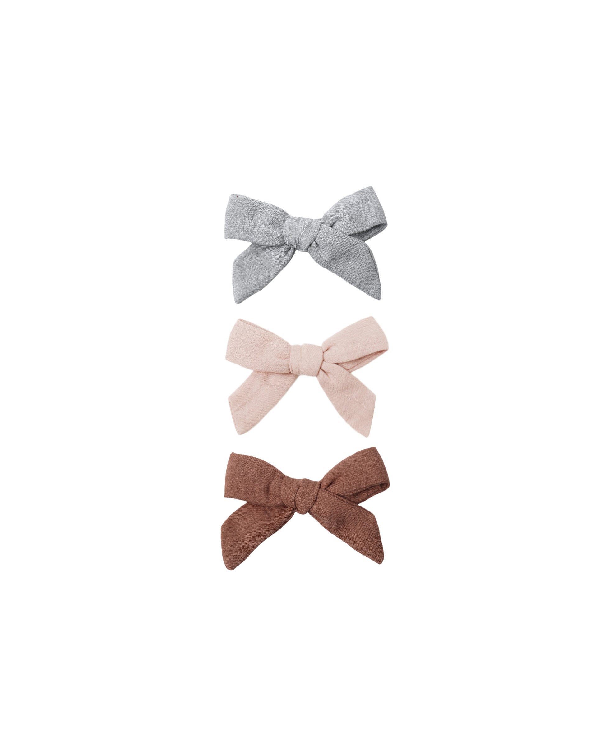 Set of three Quincy Mae sky, blush, and poppy bow hair clips featuring colorful fabric bows with clip fasteners.