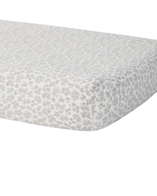 Blue floral bamboo crib sheet by Quincy Mae featuring a soft fabric with a delicate floral pattern on a light background.