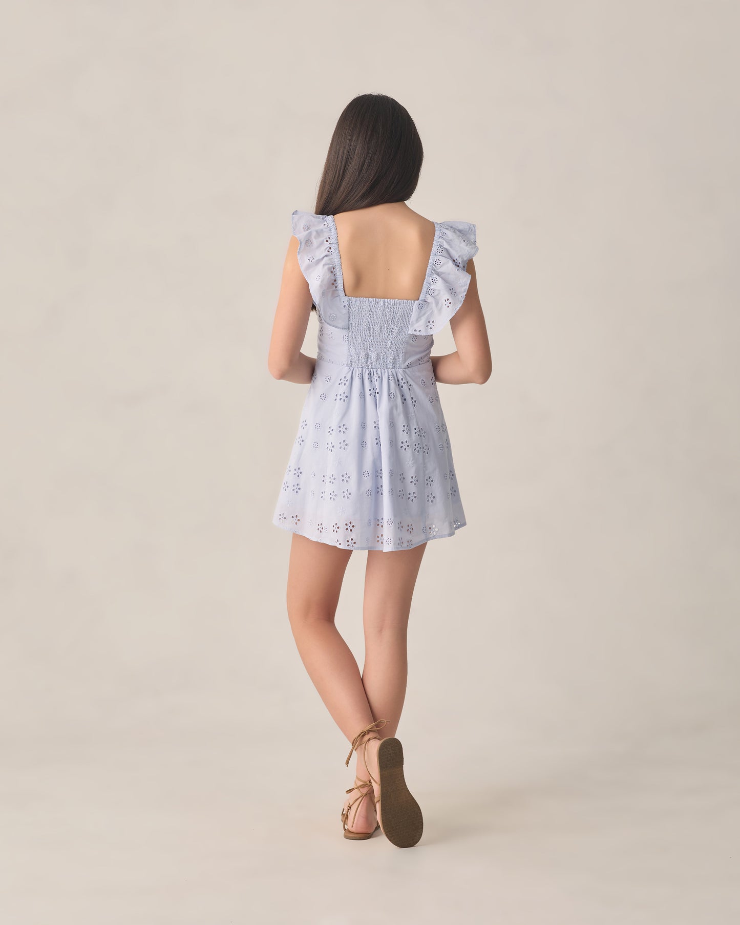 Teen periwinkle Bianca mini dress by Rylee & Cru, featuring a flowy silhouette and short sleeves, displayed on a hanger.