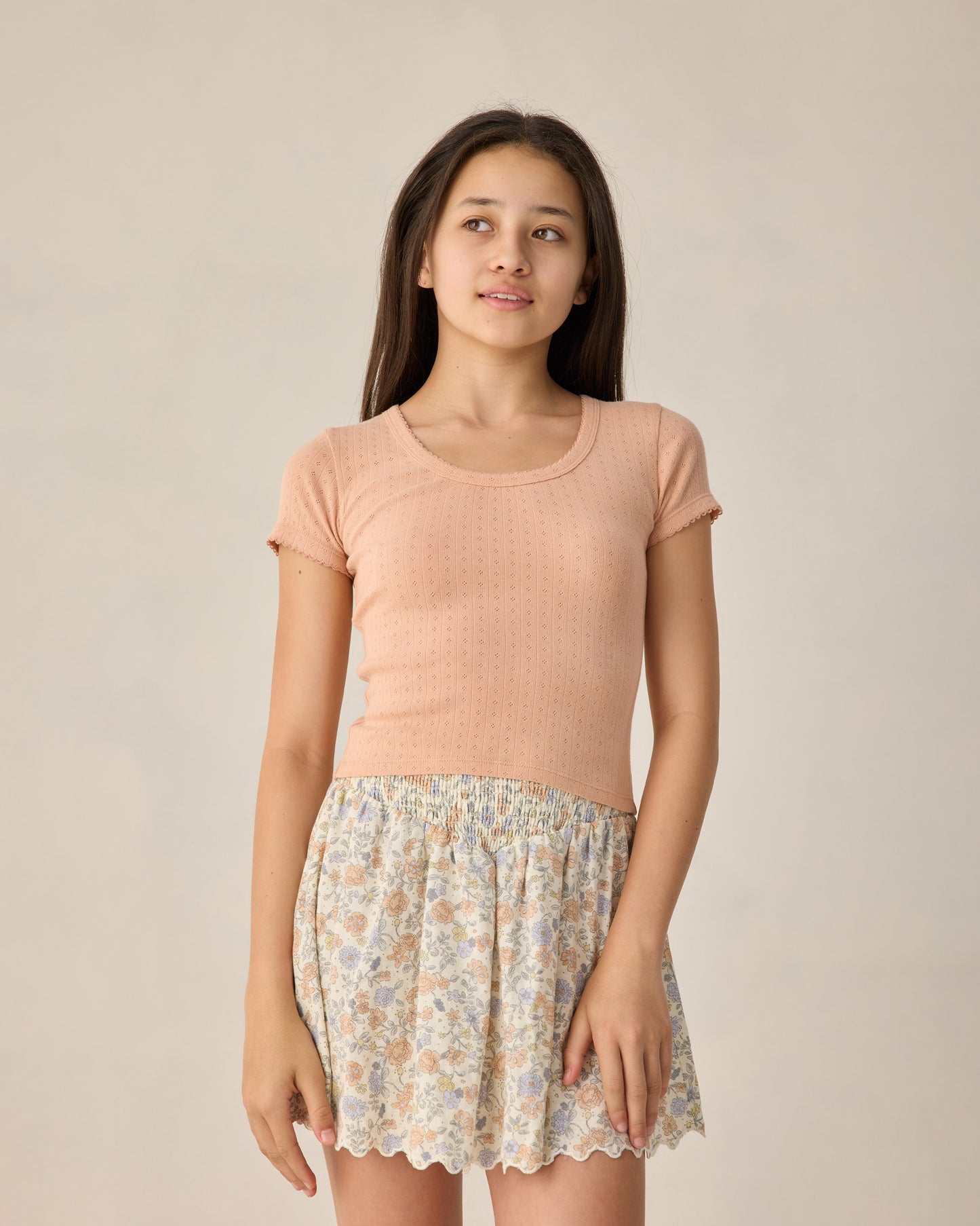 Teen Melon Pointelle Jersey by Rylee & Cru, close-up of soft, pink knit fabric with delicate pointelle pattern.