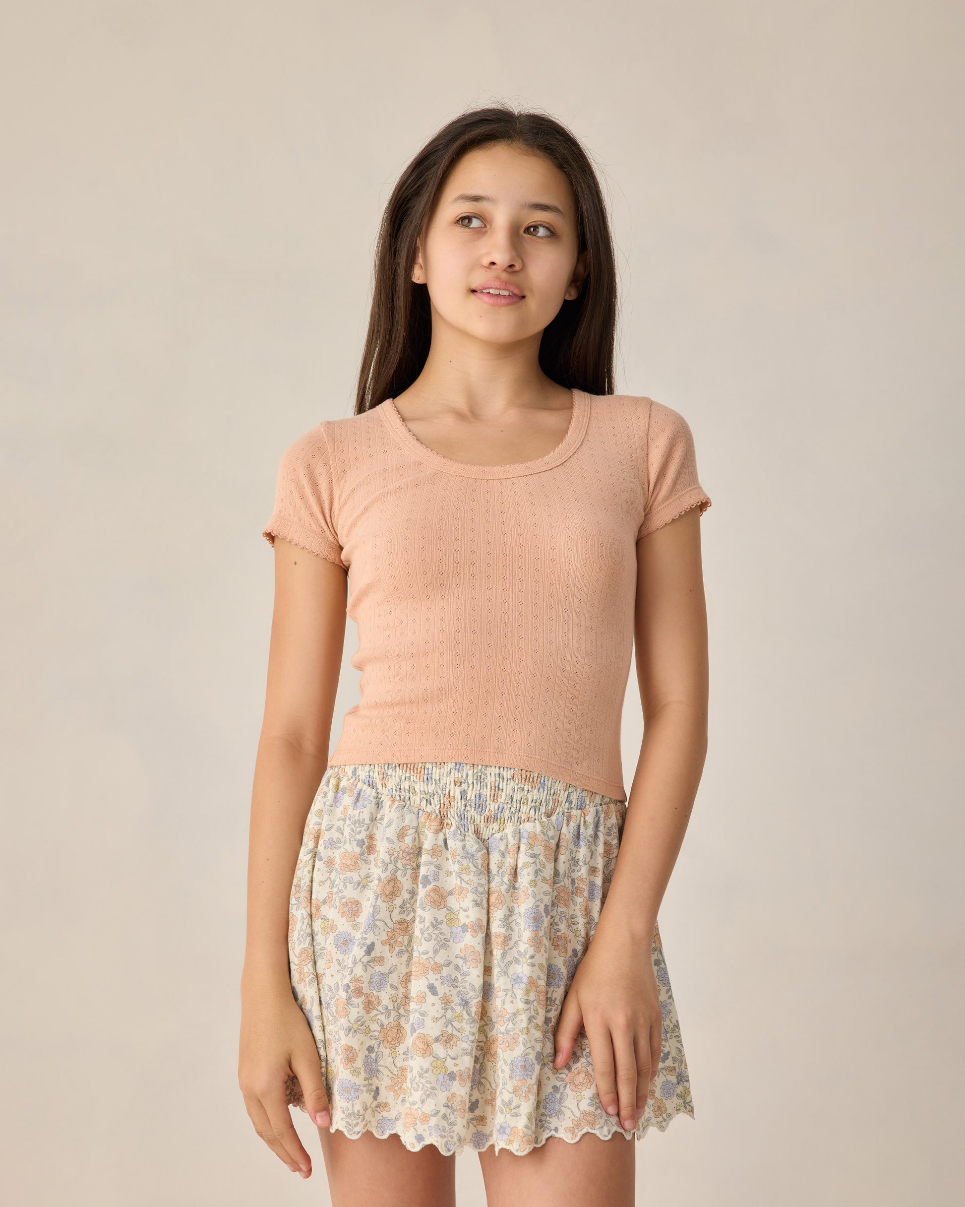 Teen Melon Pointelle Jersey by Rylee & Cru, close-up of soft, pink knit fabric with delicate pointelle pattern.