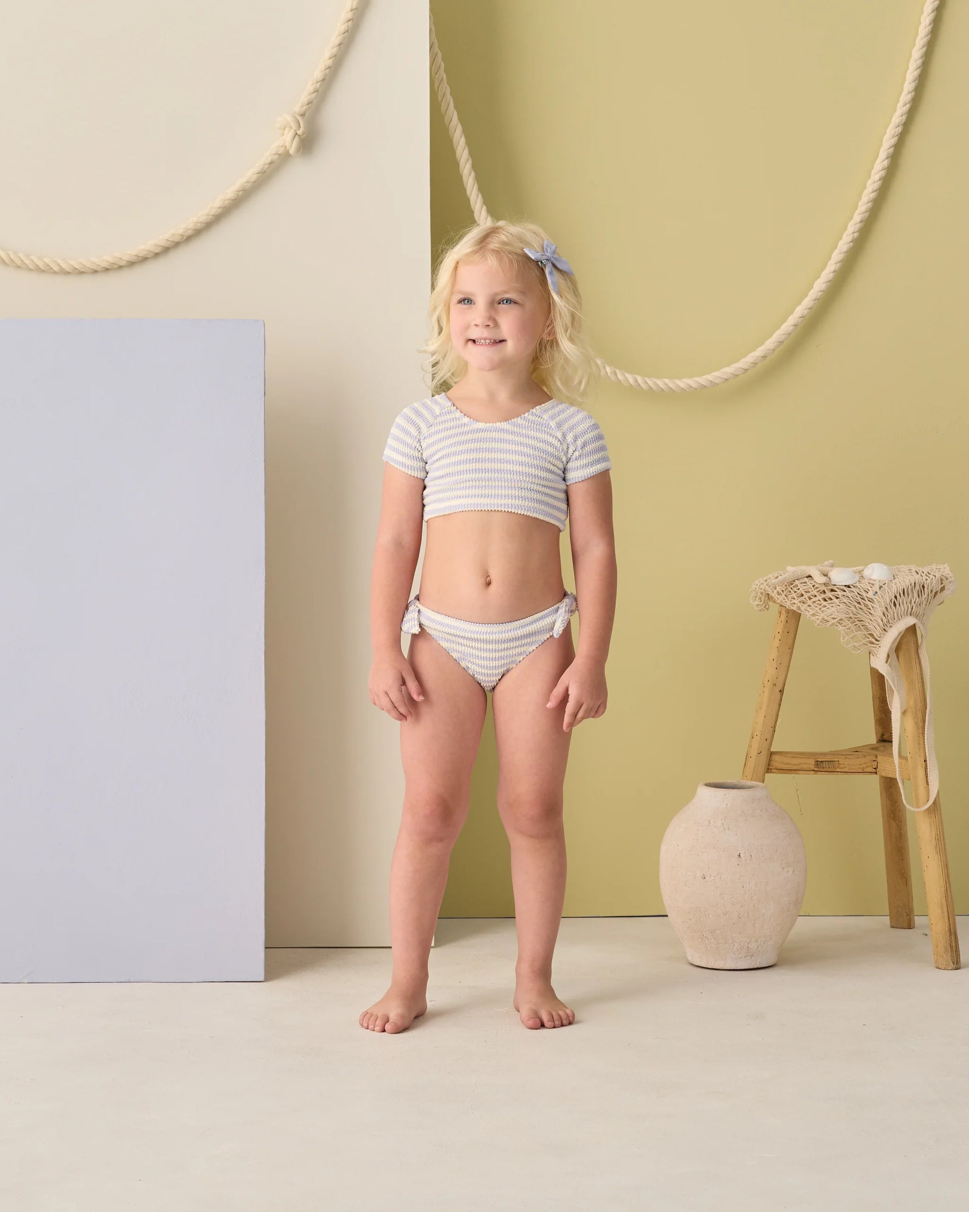 Periwinkle stripe cropped rashguard set by Rylee & Cru, featuring a fitted long-sleeve top and matching shorts for swim or beach.