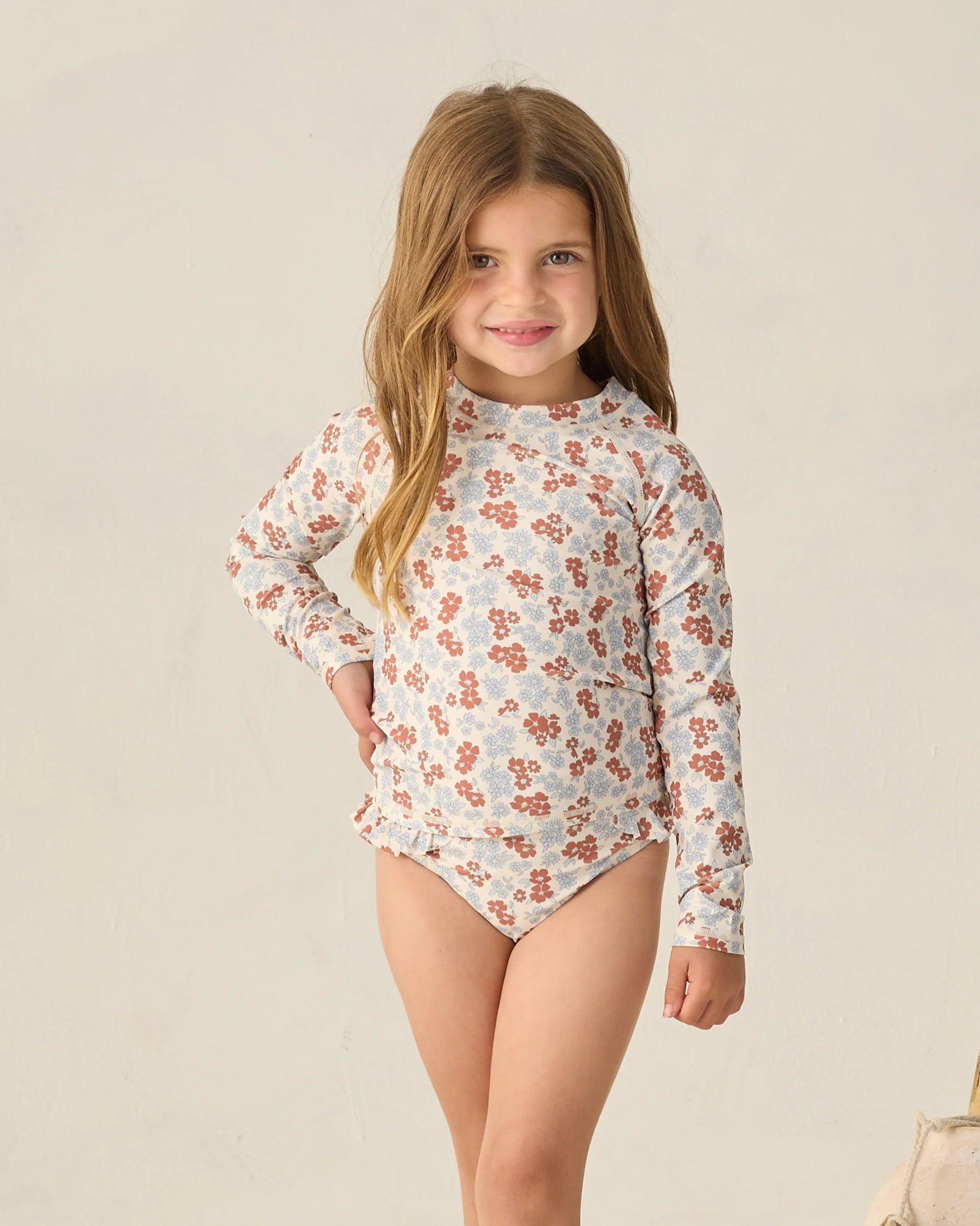 Rylee & Cru Americana Floral Maryn rashguard set with long sleeves and matching shorts for kids, featuring colorful floral print.