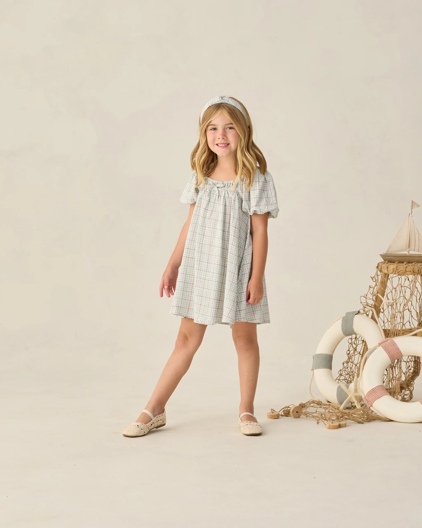 Light blue plaid Sabrina mini dress by Rylee & Cru featuring a fitted bodice and short sleeves, displayed on a hanger.