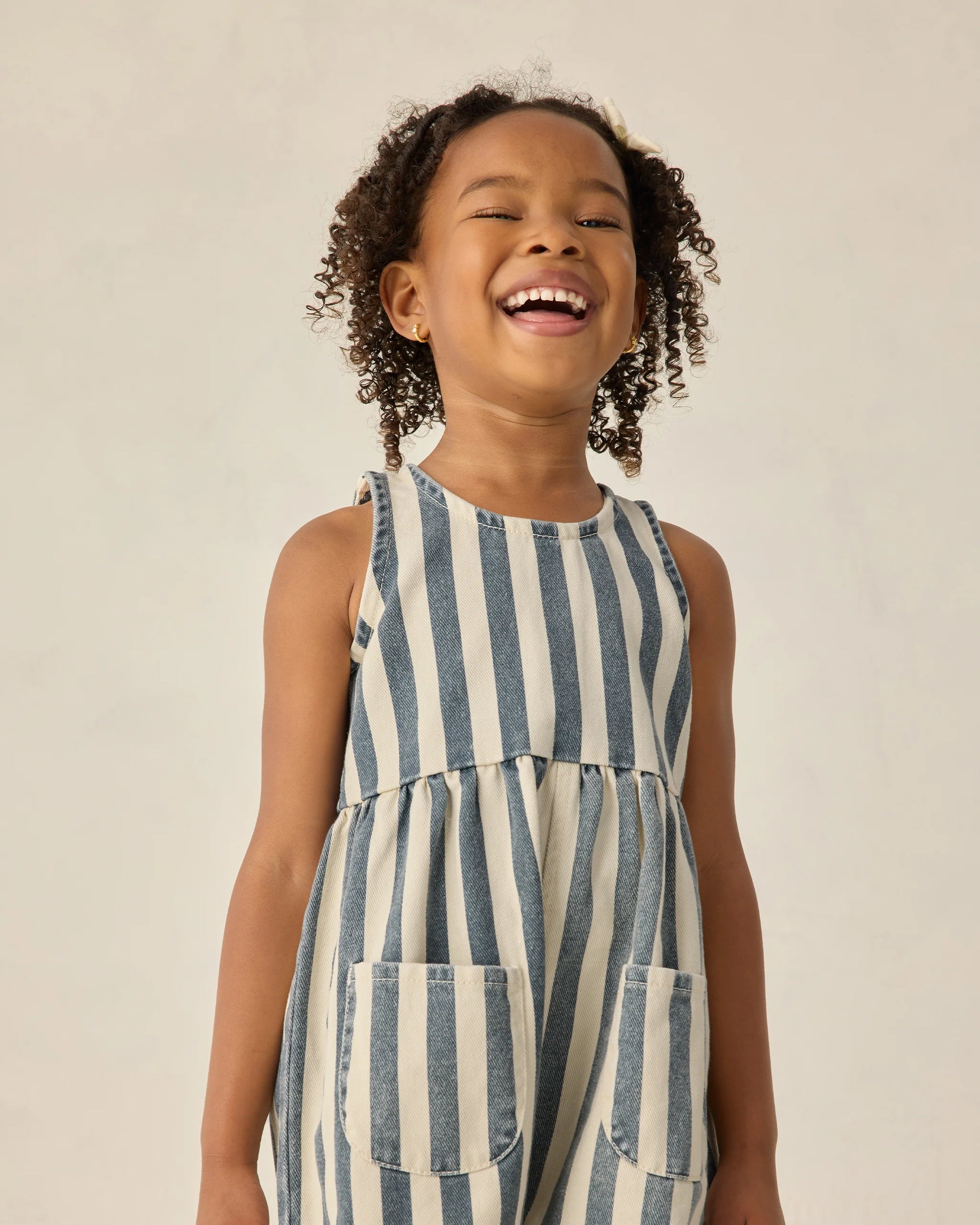 Navy and white striped Dani romper by Rylee & Cru, featuring short sleeves and a comfortable, casual fit for toddlers.