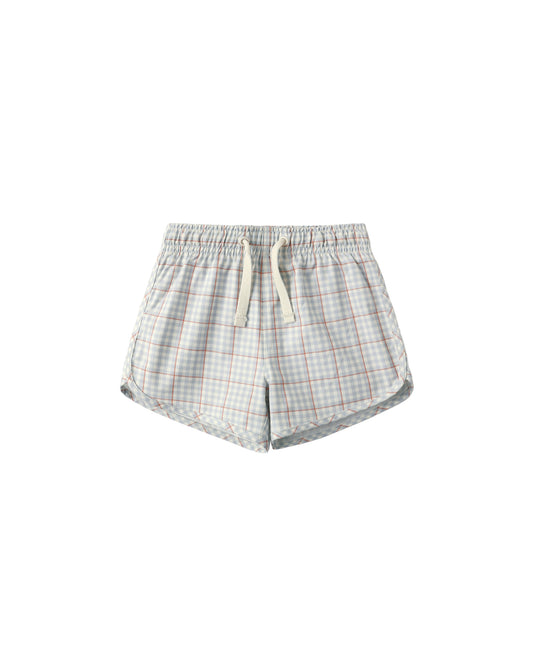 Light blue plaid swim trunks by Rylee & Cru featuring a comfortable fit and vibrant pattern for boys' beachwear.