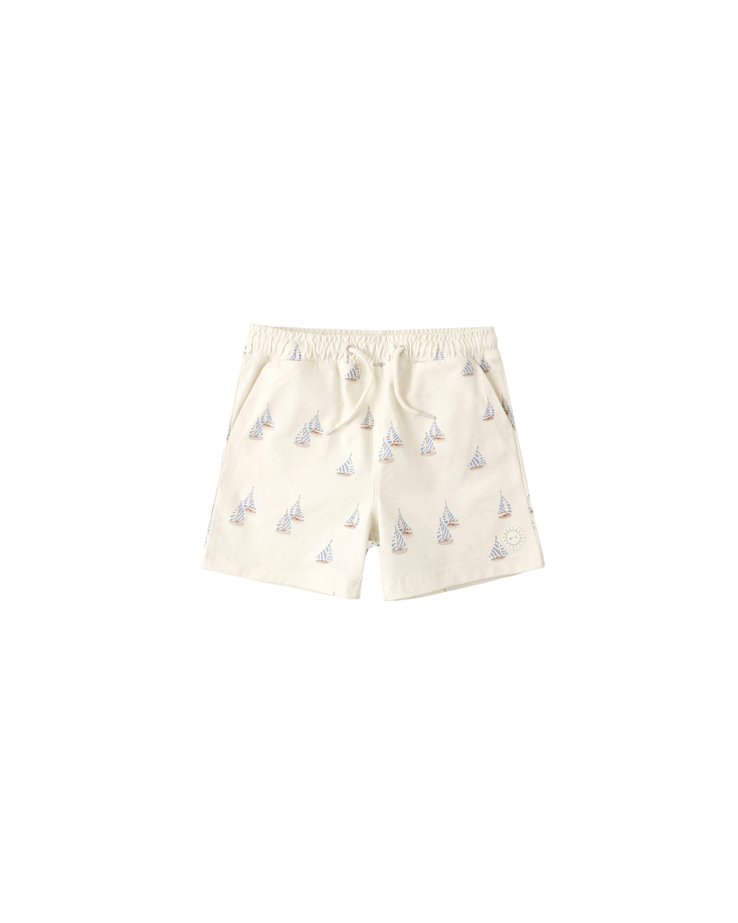 Natural-colored Rylee & Cru Sail Boardshort featuring a relaxed fit, lightweight fabric, and adjustable waistband for comfort.
