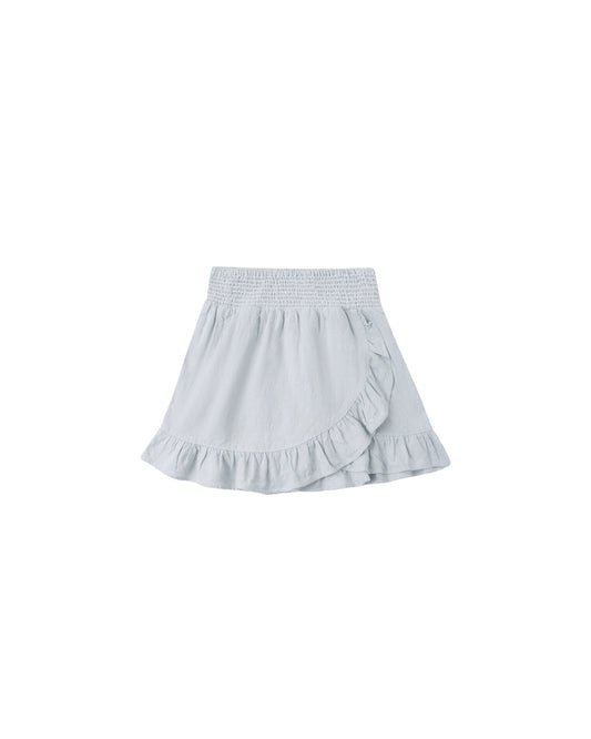 Heathered light blue wrap ruffle skirt from Rylee & Cru, showing soft fabric and feminine ruffle details.