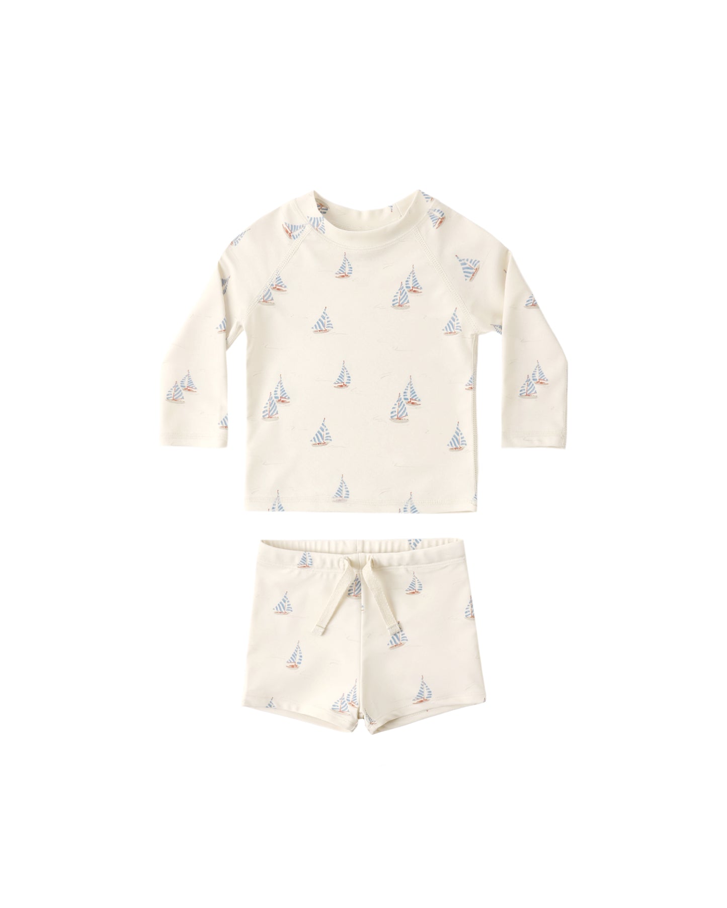 Rylee & Cru Sail Boys Rashguard Set featuring natural-colored long sleeve rashguards with sailboat print for sun protection and play.