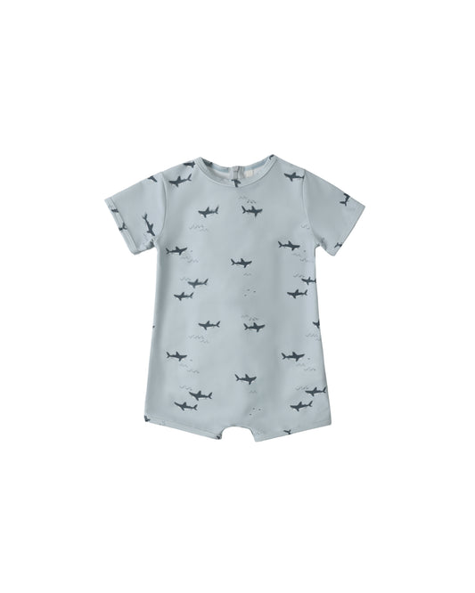 Light blue Rylee & Cru Sharks Shorty One Piece swimsuit with shark print, suitable for kids' swimming and water activities.