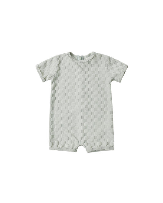 Rylee & Cru Sage Check Shortie One Piece swimsuit in gray with a playful check pattern, featuring adjustable straps and a relaxed fit.