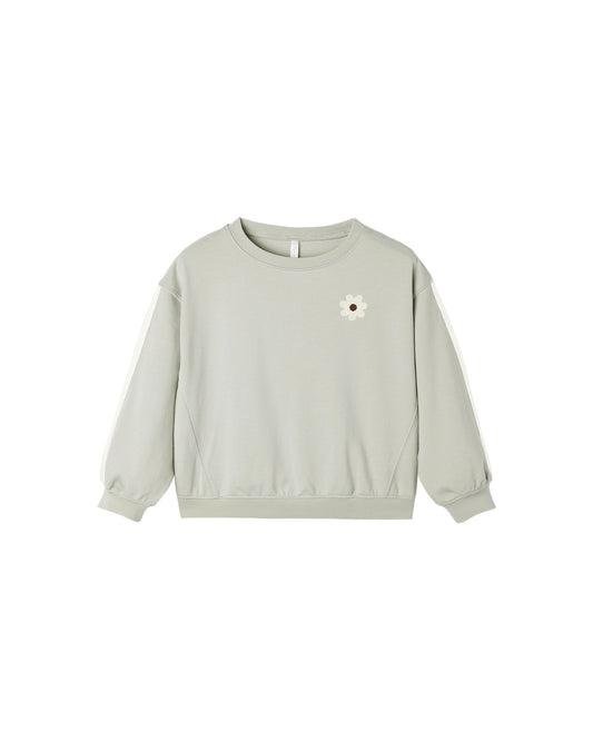 Rylee & Cru oversized sage sweatshirt with relaxed fit and soft fabric, shown on a flat lay with folded sleeves and casual styling.