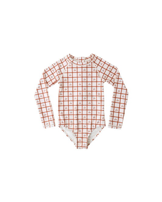 Cherry check Delphine rashguard one-piece swimsuit by Rylee & Cru, featuring a stylish cherry pattern and comfortable fit.