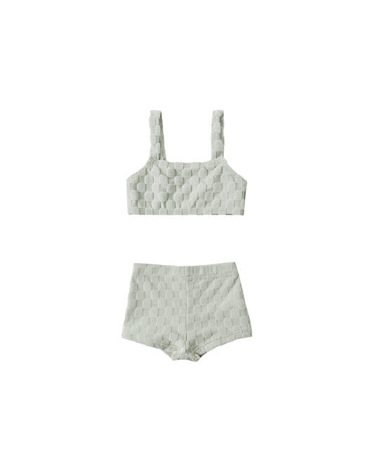 Rylee & Cru Sage Check Dylan bikini top in gray, featuring a check pattern and adjustable straps on a mannequin.