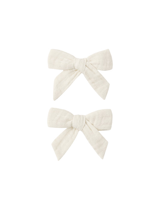 Set of 2 natural fabric bows from Rylee & Cru, soft and stylish accessories for babies or toddlers.