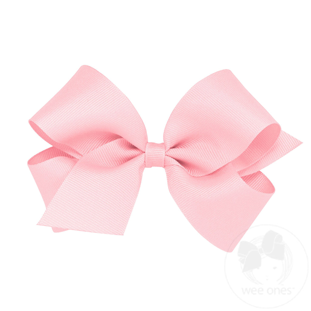 Medium classic grosgrain hair bow by wee ones, plain wrap style, featuring a smooth pink grosgrain ribbon bow for children's hair.