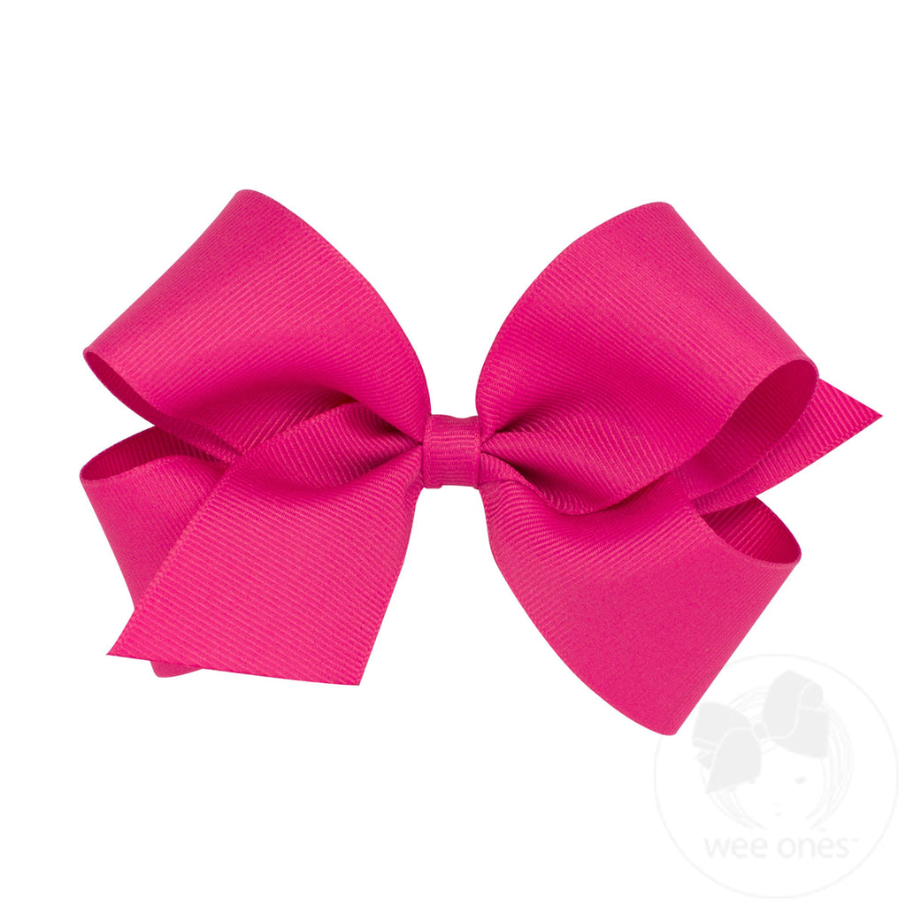 Medium classic grosgrain hair bow by Wee Ones, plain wrap style, shown in soft pink color with tied knot and smooth grosgrain texture.