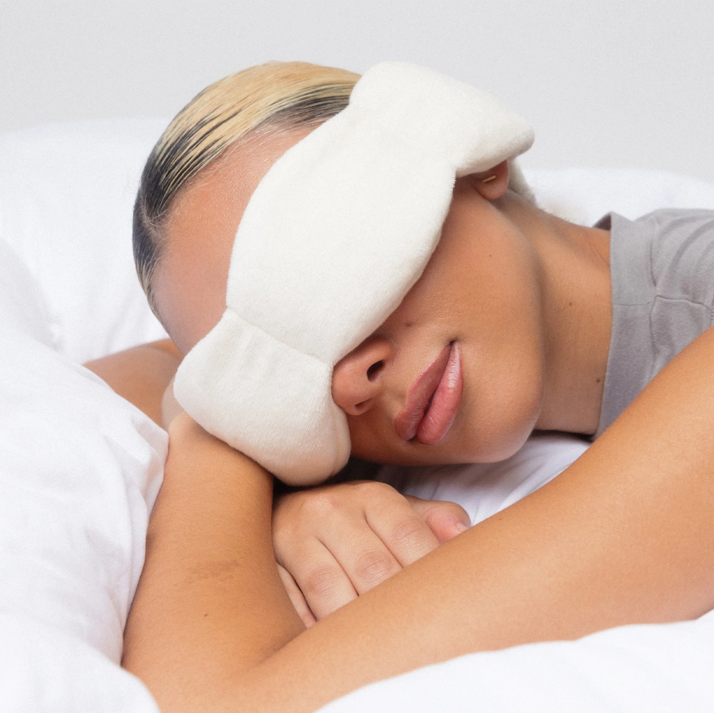 Nodpod sleep mask in navy blue fabric, designed to block light and promote restful sleep with a soft, comfortable fit.