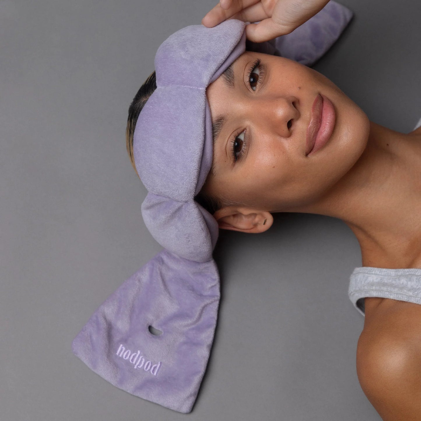 White nodpod sleep mask with soft, plush fabric designed to block light for restful sleep.