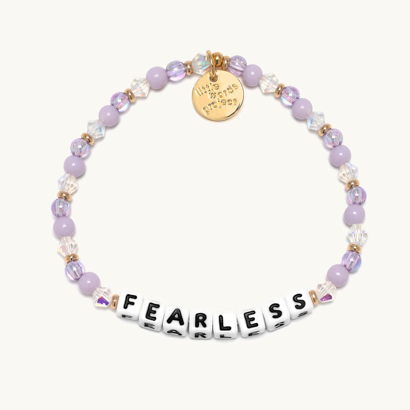Close-up of a Little Words Project bracelet with the word "Fearless" engraved, showcasing its delicate chain and minimalist design.