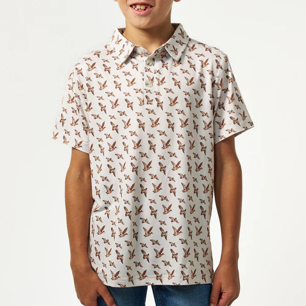 Youth Burlebo Mallards flying in performance polo shirt, featuring vibrant mallard bird design on navy fabric.