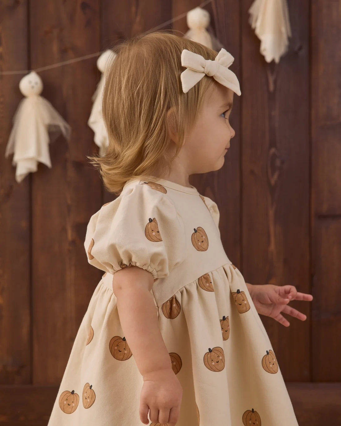 Quincy Mae Pumpkins Darla Dress for babies, featuring a charming pumpkin pattern and soft fabric in a cute, comfortable style.