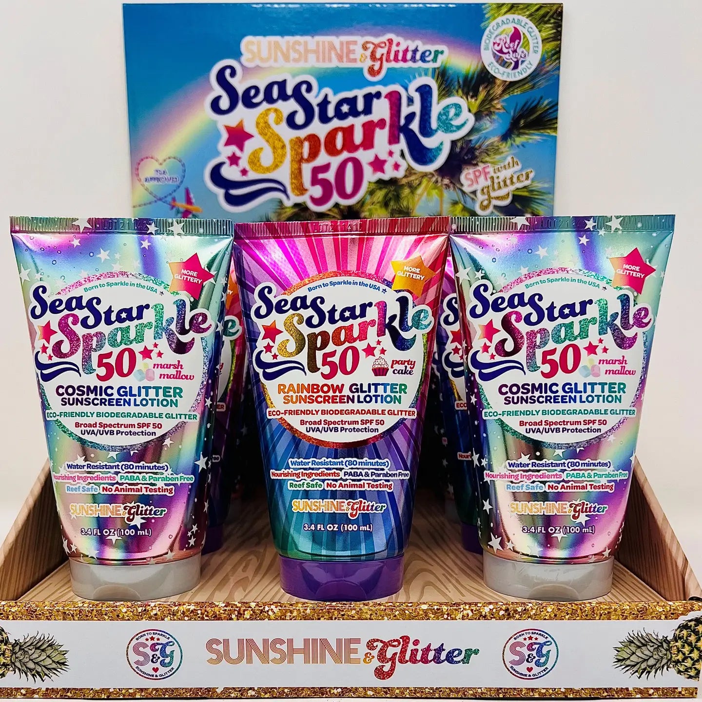 Sea Star Sparkle Cosmic Glitter Sunscreen Lotion by Sunshine & Glitter, showing the shimmering lotion in a sleek bottle with cosmic design.