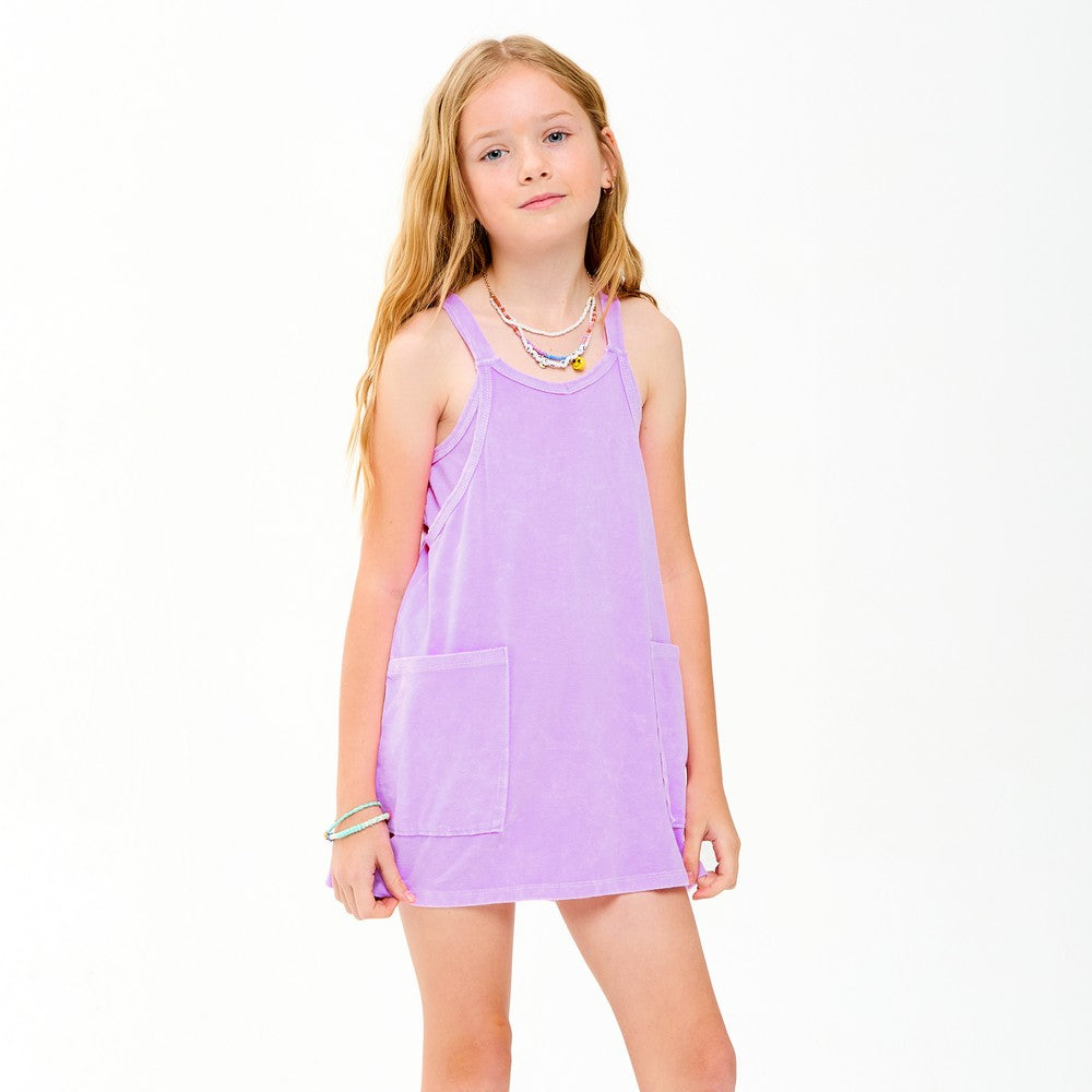 Lavender mineral-washed dress with built-in romper lining by Good Girl, featuring a flowy fabric and adjustable straps.