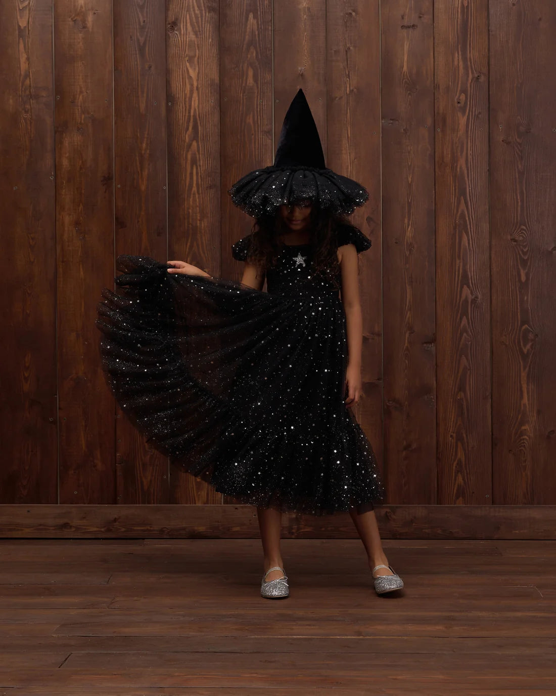 Black witch hat by Noralee featuring a pointed top and wide brim, perfect for costume or Halloween accessories.