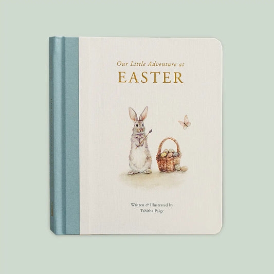 Open children's book titled "Our Little Adventure At Easter" by Paige Tate & Co., featuring colorful illustrations.