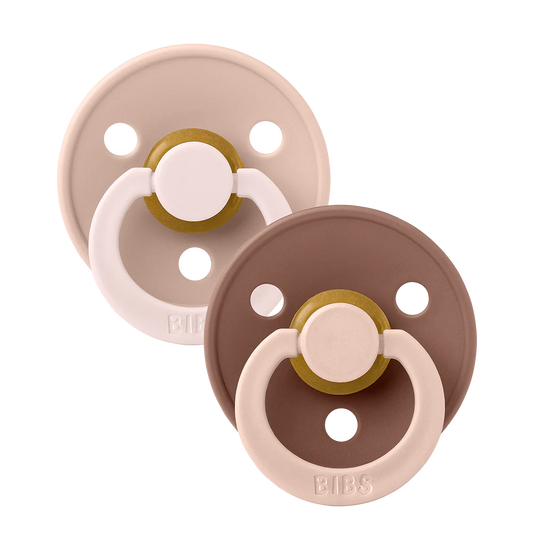 Two BIBS Pacifiers in Fusion latex, woodchuck and blush colors, with natural latex nipples and colorful silicone shields.