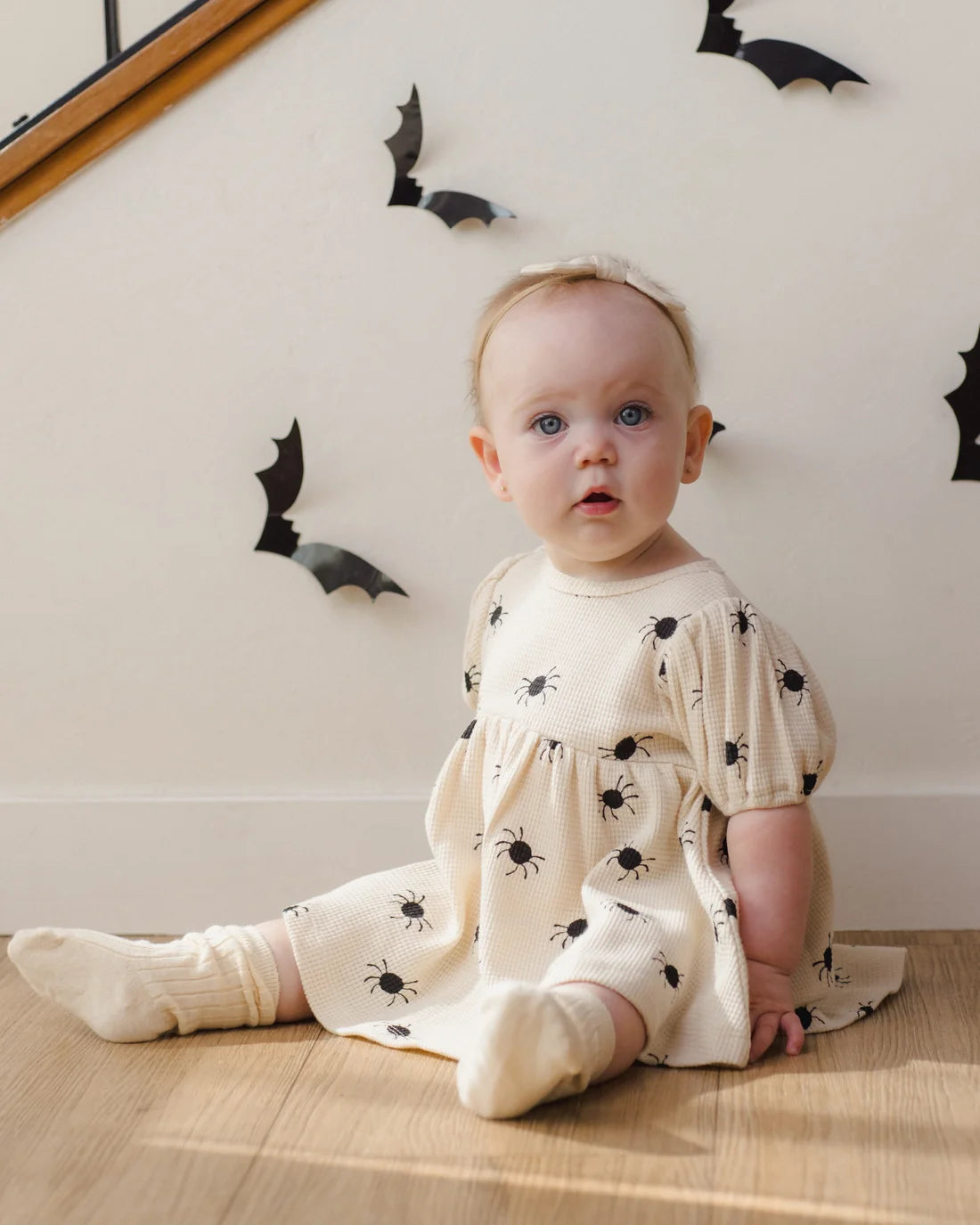 Quincy Mae Bitsy Spider Darla Dress for babies in soft fabric with a charming spider pattern and ruffle details.