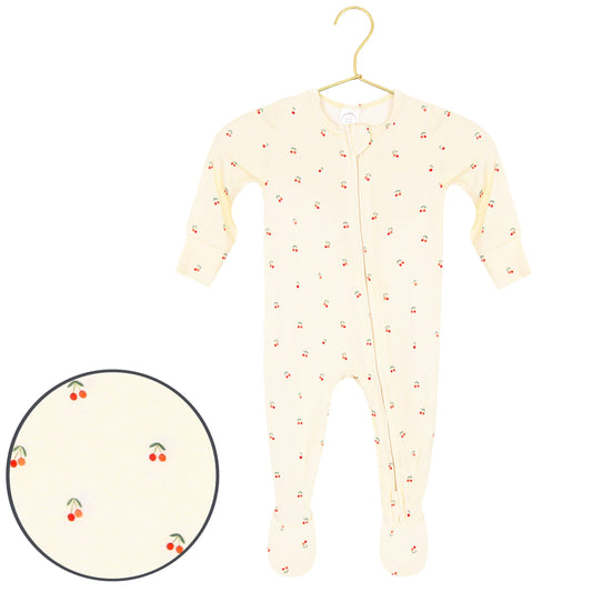 Lou Lou & Co Sadie Zipper Footie featuring a cherry print on a soft, cozy fabric with a front zipper and footed design for comfort.
