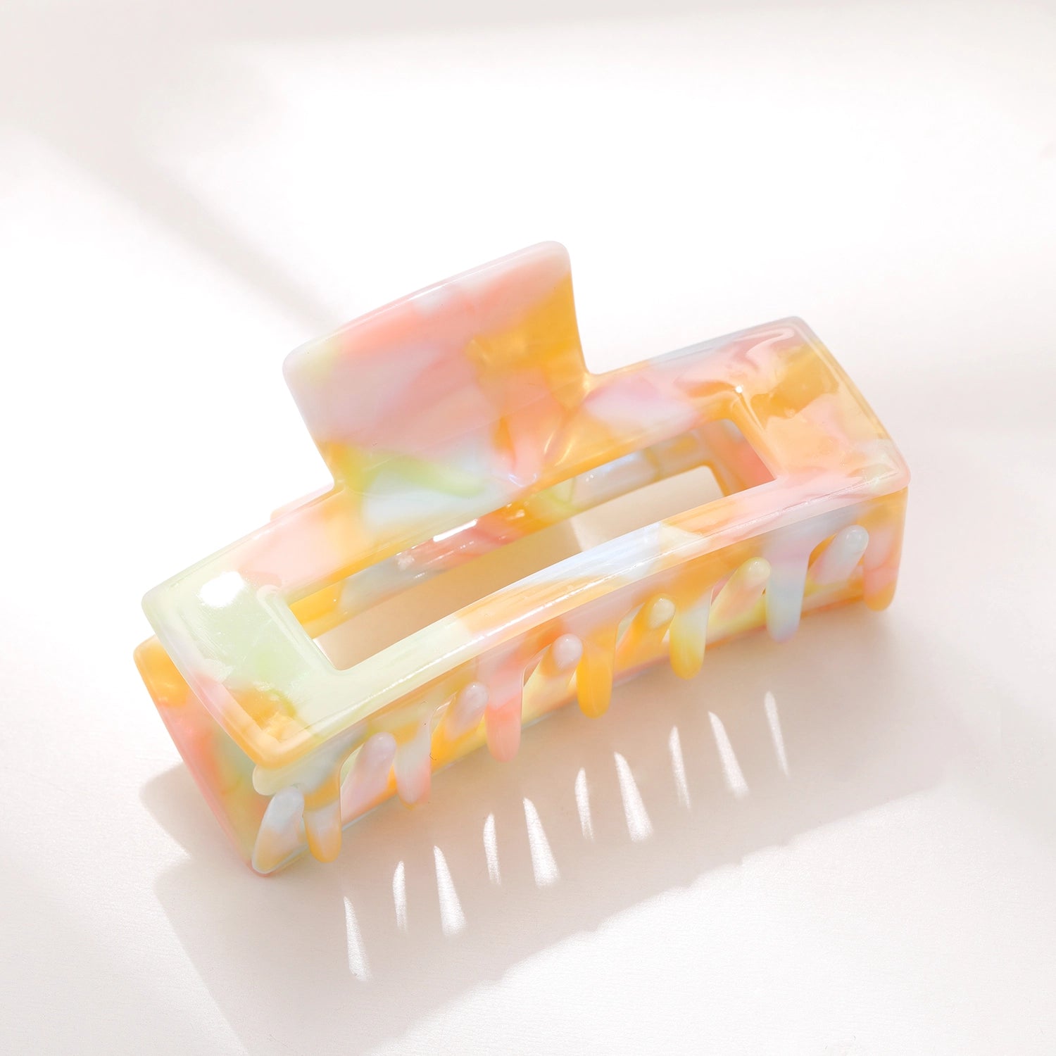 Pastel watercolor hair clip from Sweet E's Children's Boutique with soft, colorful design and floral accents for children