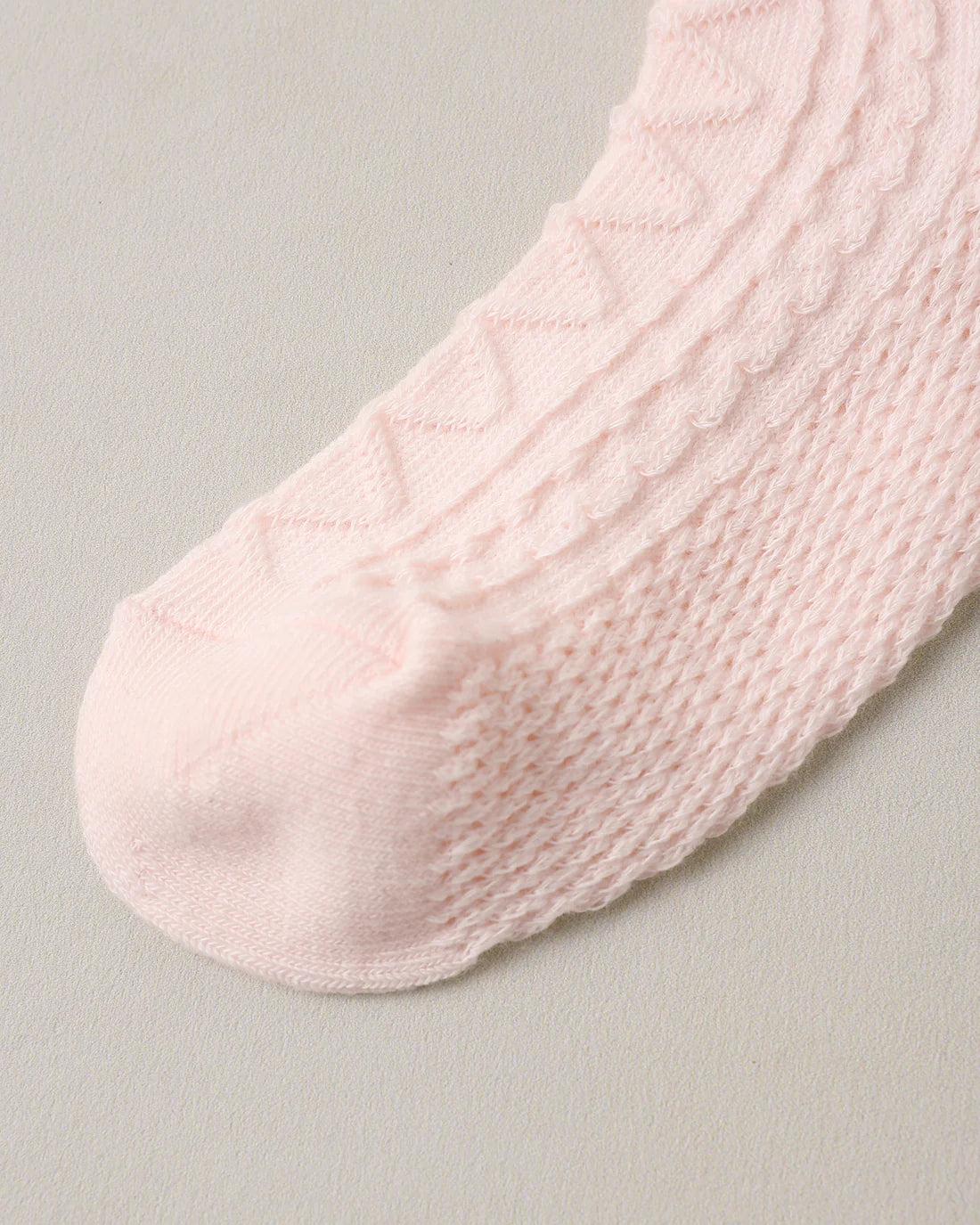 Black and blush ruffle socks by Noralee featuring layered ruffle design and soft knit fabric.
