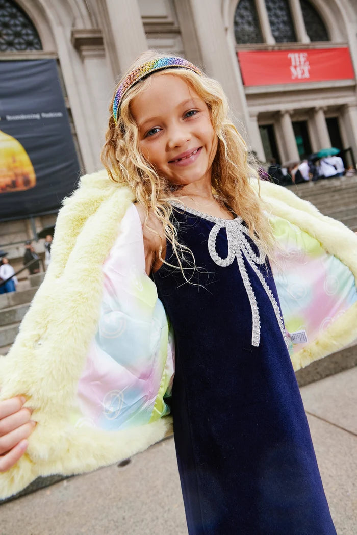 Velvet bow princess dress for girls by Lola and The Boys, pink with a large satin bow and ruffled sleeves, perfect for special occasions.