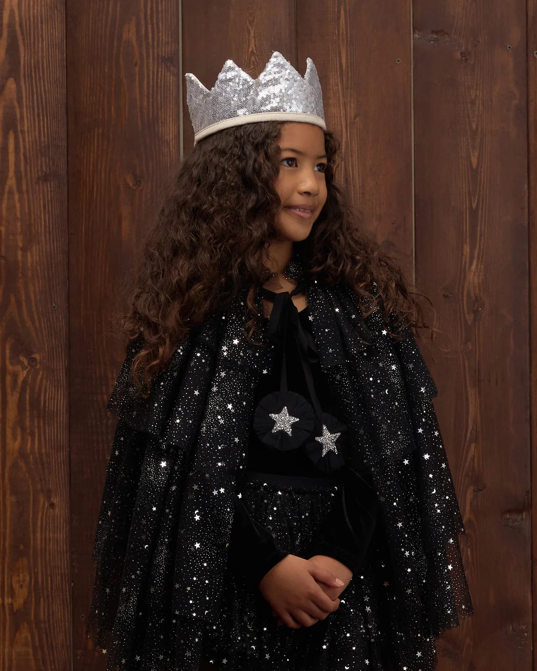 Black tulle cape by Noralee featuring sheer fabric and elegant drape, perfect for adding a stylish layer to an outfit.