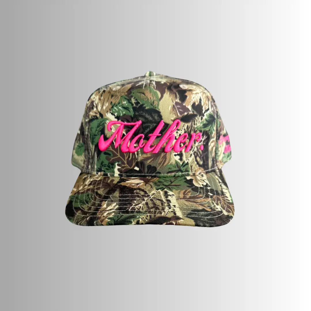 Mother Hats Strong As A Mother® canvas camo hat with adjustable strap and embroidered logo, casual outdoor headwear.