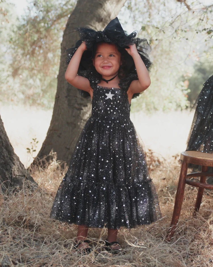 Black witch hat by Noralee with pointed crown and wide brim, made of soft fabric, perfect for Halloween costumes or witch-themed outfits.
