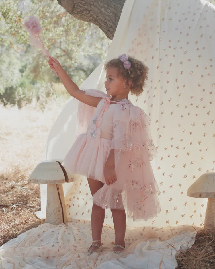 Pink tulle cape by Noralee featuring delicate layers and a soft, dreamy appearance, perfect for special occasions or costumes.