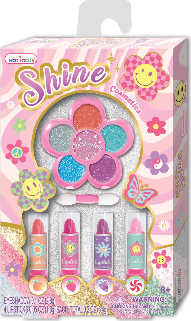 Hot Focus Groovy Flower Shine Cosmetics product image showing colorful floral packaging and makeup application tools.