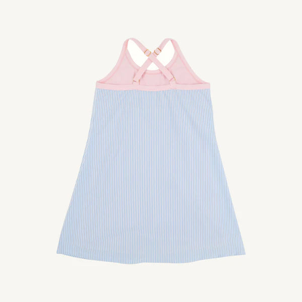 The Beaufort Bonnet Company Little Miss Tennis Dress in blue seersucker with pink palm details, back view.