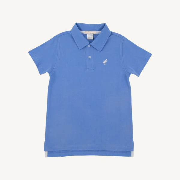 Blue beach polo shirt from Sunrise Blvd Prim & Proper collection by The Beaufort Bonnet Company, featuring colorful stork print.