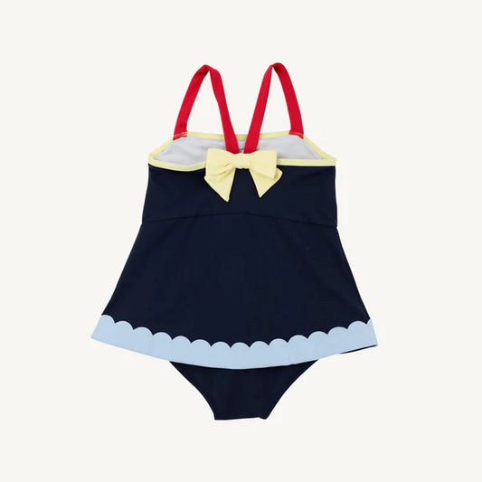 Nantucket Navy Stratford scallop swimsuit by The Beaufort Bonnet Company with red and blue accents and yellow back detail.